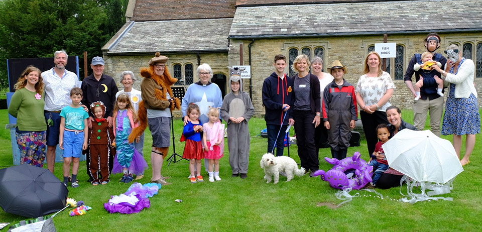 Scampton church family congregation in the churchyard dressed up as animals